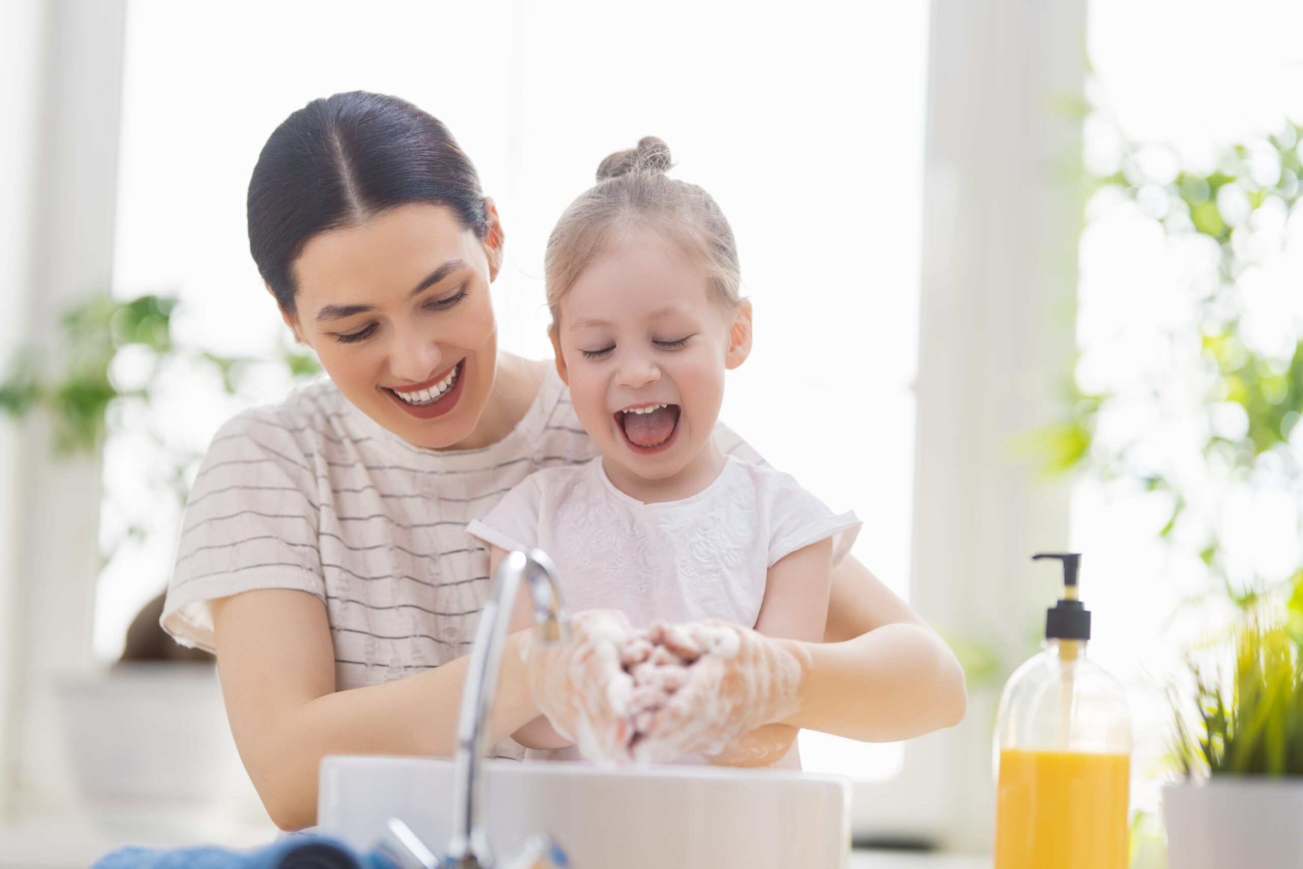 a,cute,little,girl,and,her,mother,are,washing,their